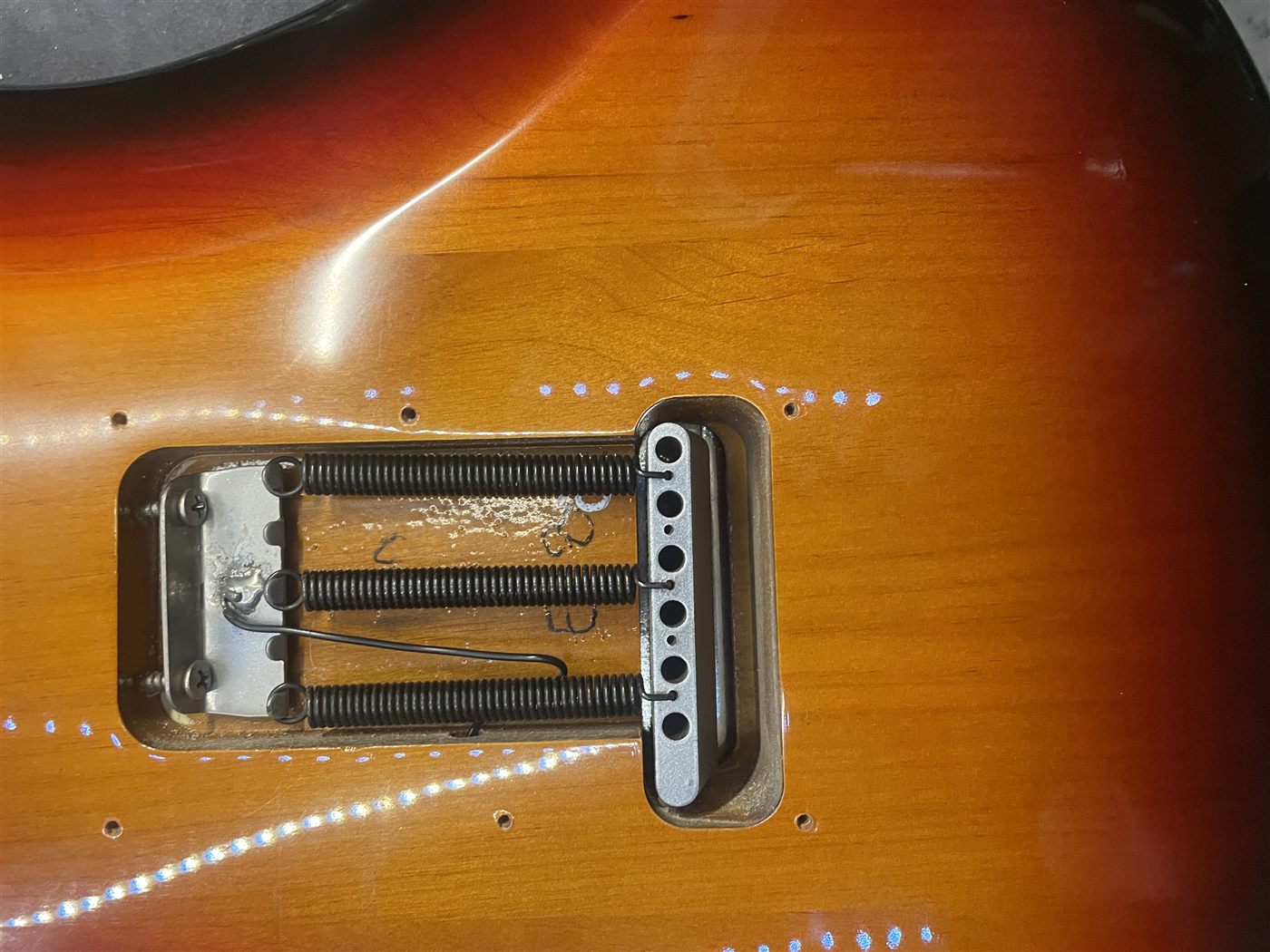 Two-point Stratocaster tremolo bridge before cleaning