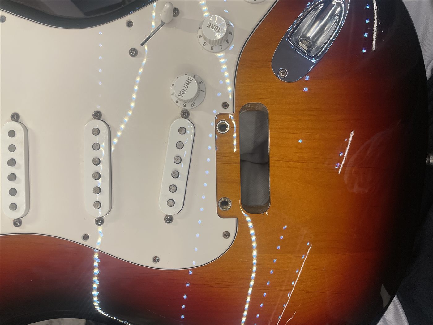 Polished 3-color sunburst Stratocaster body after service